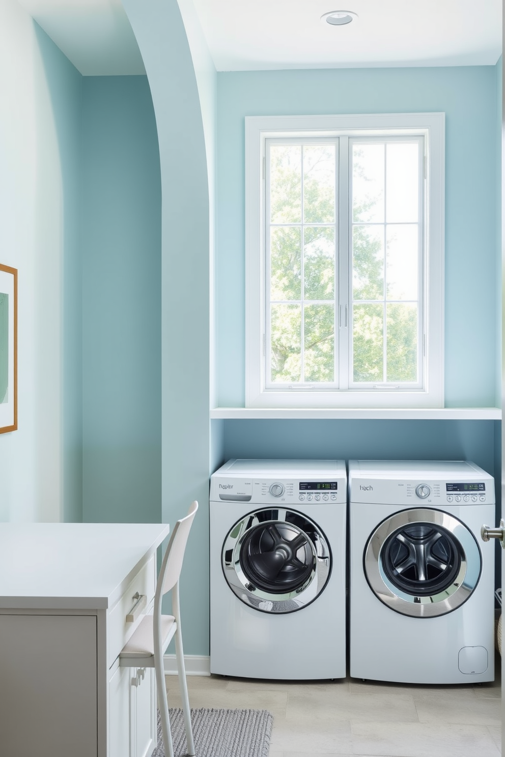 A bright and airy laundry room with a small workspace area. The walls are painted in a soft pastel blue, and natural light floods in through a large window. To the left, there's a sleek white desk with a comfortable chair, perfect for folding clothes or managing household tasks. The laundry appliances are neatly tucked away in cabinetry that matches the room's color scheme, creating a cohesive look.