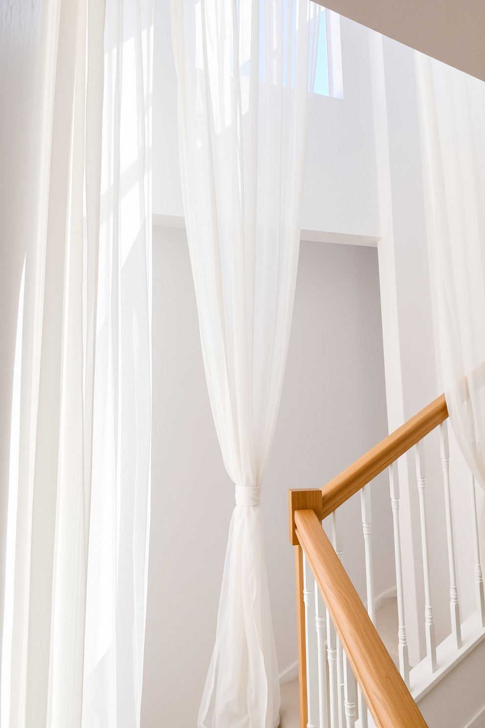 A bright and airy staircase adorned with breezy sheer curtains gently flowing in the summer breeze. The walls are painted in a soft white hue, complemented by natural wood accents on the staircase railing.